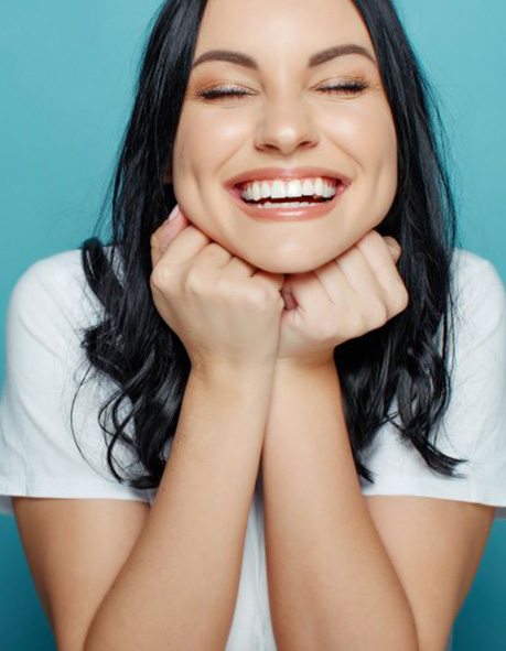 Lady smiles radiantly?