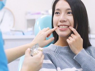 Woman in dental chair during consultation