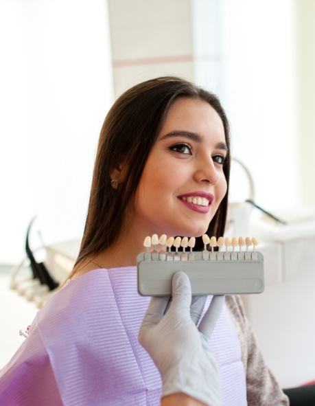 veneer being placed on bottom tooth 