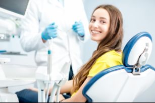 Smiling woman in the dental chair